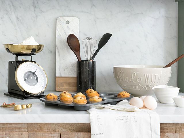 https://www.goodhomesmagazine.com/wp-content/uploads/2019/09/amara-black-brass-kitchen-scales-with-baking-accessories.jpg
