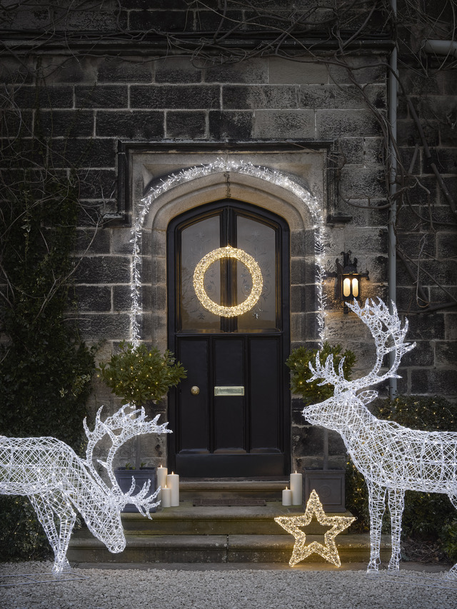 Christmas porch light display with reindeer and stars