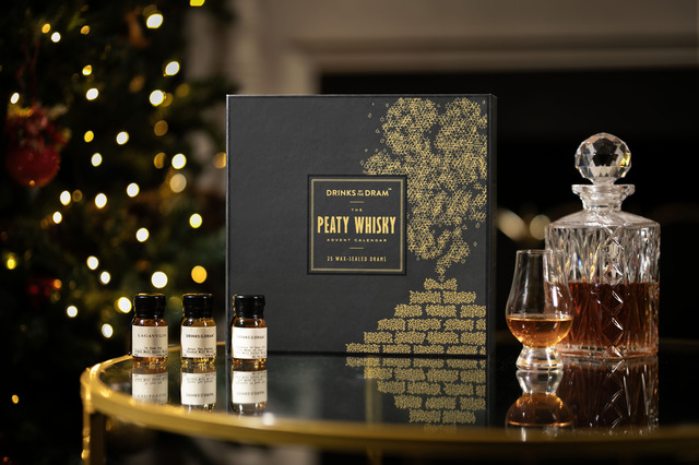 Peated whisky advent calendar with christmas tree in background