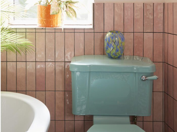 Art deco bathroom - blue toilet and pink tiles