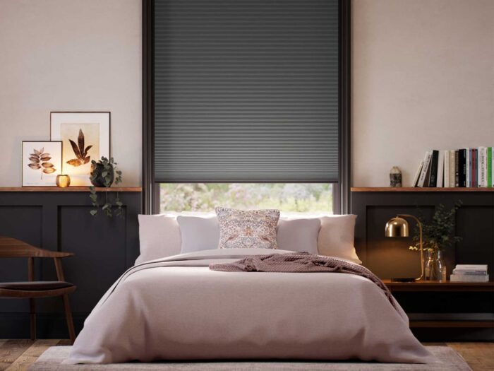 Consider a blackout blind to keep your bedroom cool and keep out the heat