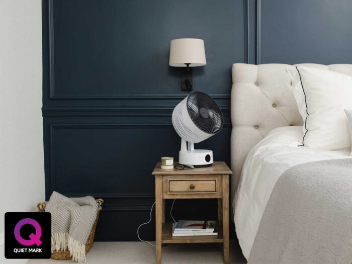 Put a fan on your bedside table to keep cool through the night in a heatwave