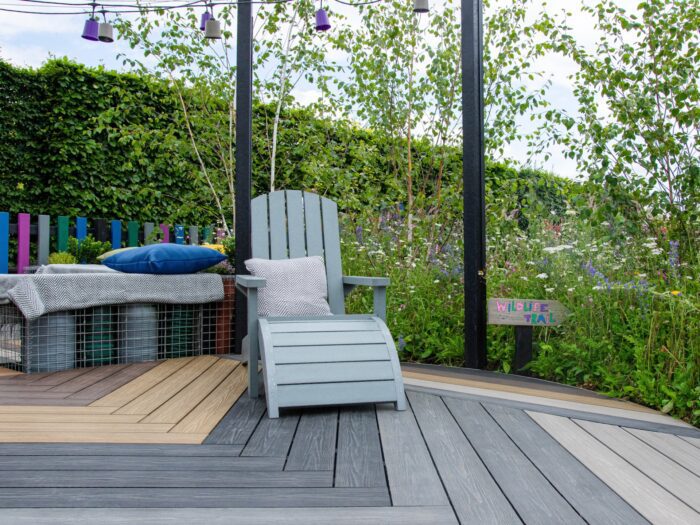 Multicoloured composite decking in eco garden with nature reserve