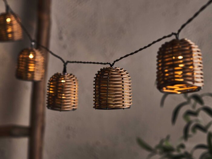 Look at a rustic way of stringing fairy lights through your garden