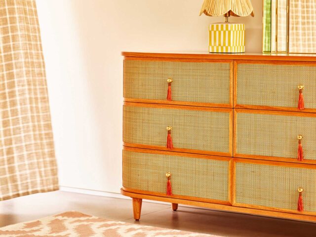 Mix your rattan with bright colours with this Oliver Bonas set of drawers with orange tassels