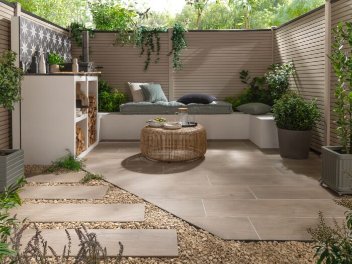 Everscape plank wood effect tiles in garden with banquette seat and pizza oven