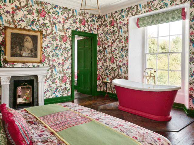 Add a hot pink bath in a bedroom for a splash of colour