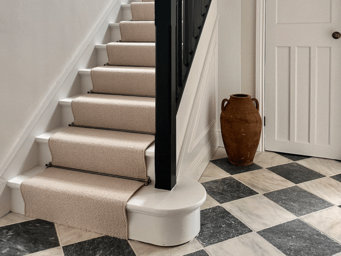 Go chic and sleek with Tapi's neutral toned stair runners and brass stair rods