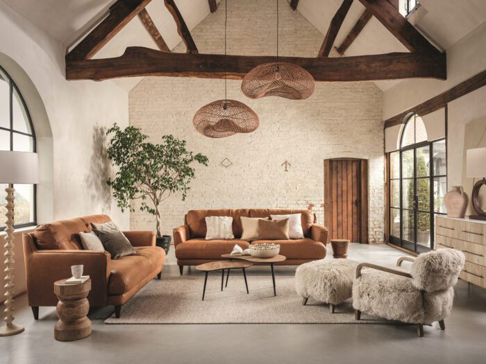 The brown leather sofa is a timeless classic