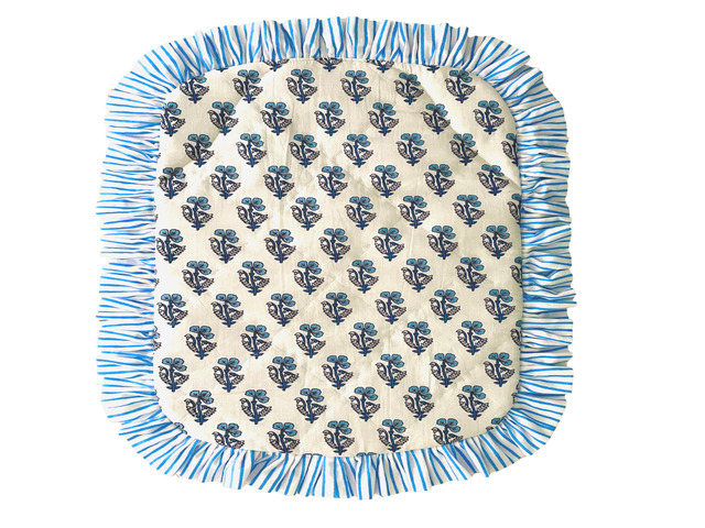 Blue frilly ditzy cover on white background