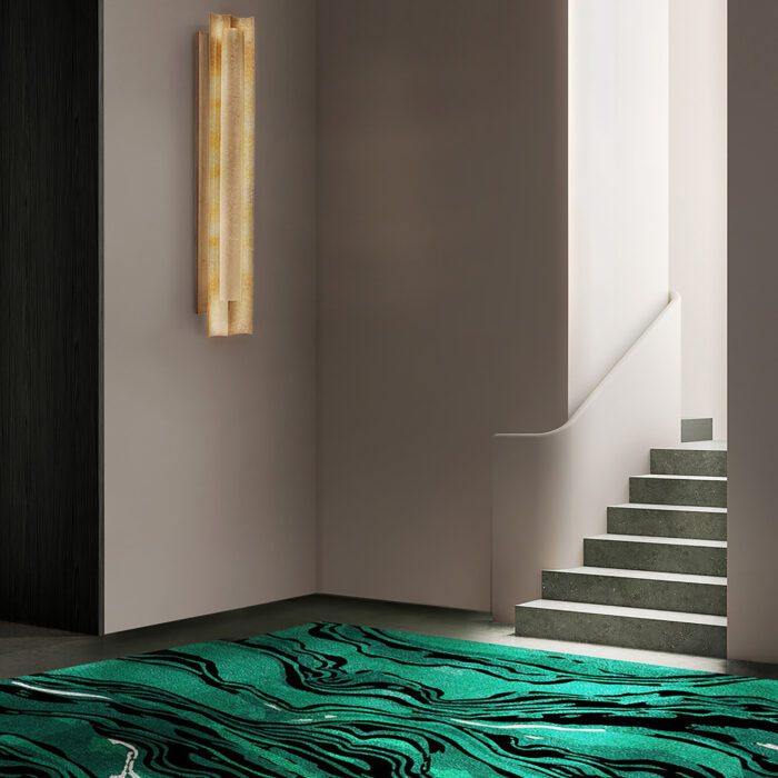 A hallway with a green patterned rug