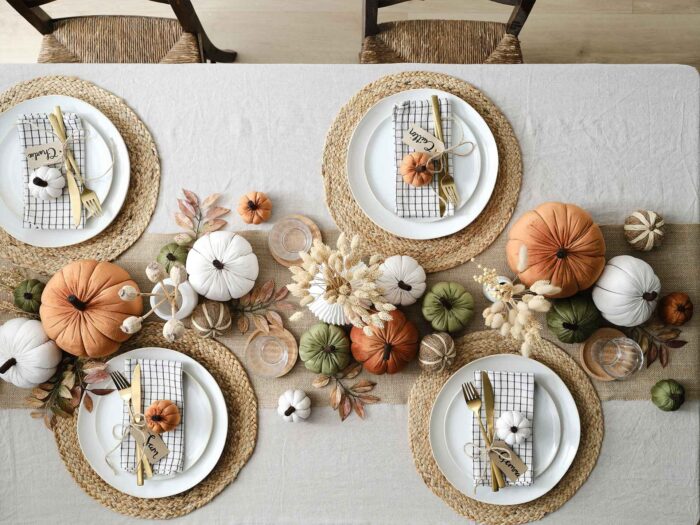 Line your table runners with stuffed pumpkins to make the perfect harvest scene