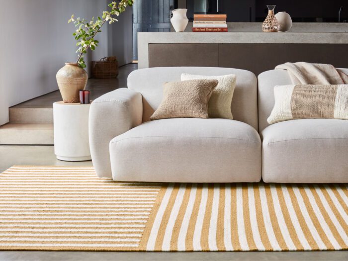 Living room with bold striped yellow and white carpet