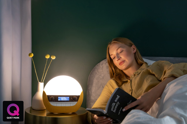 Woman reading with Lumie bodyclock