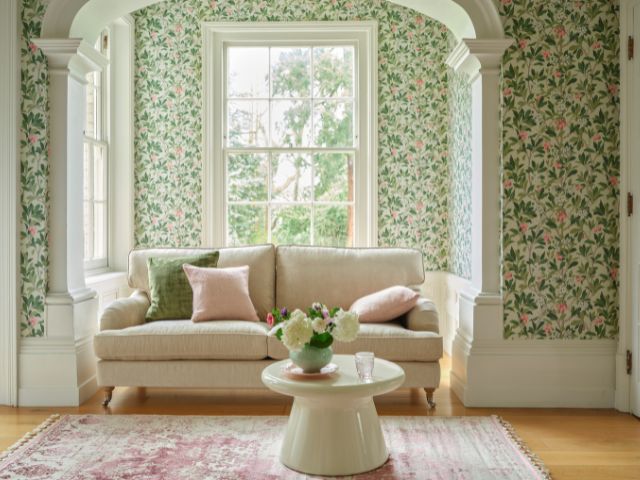 Green vintage style living room with patterned wallpaper