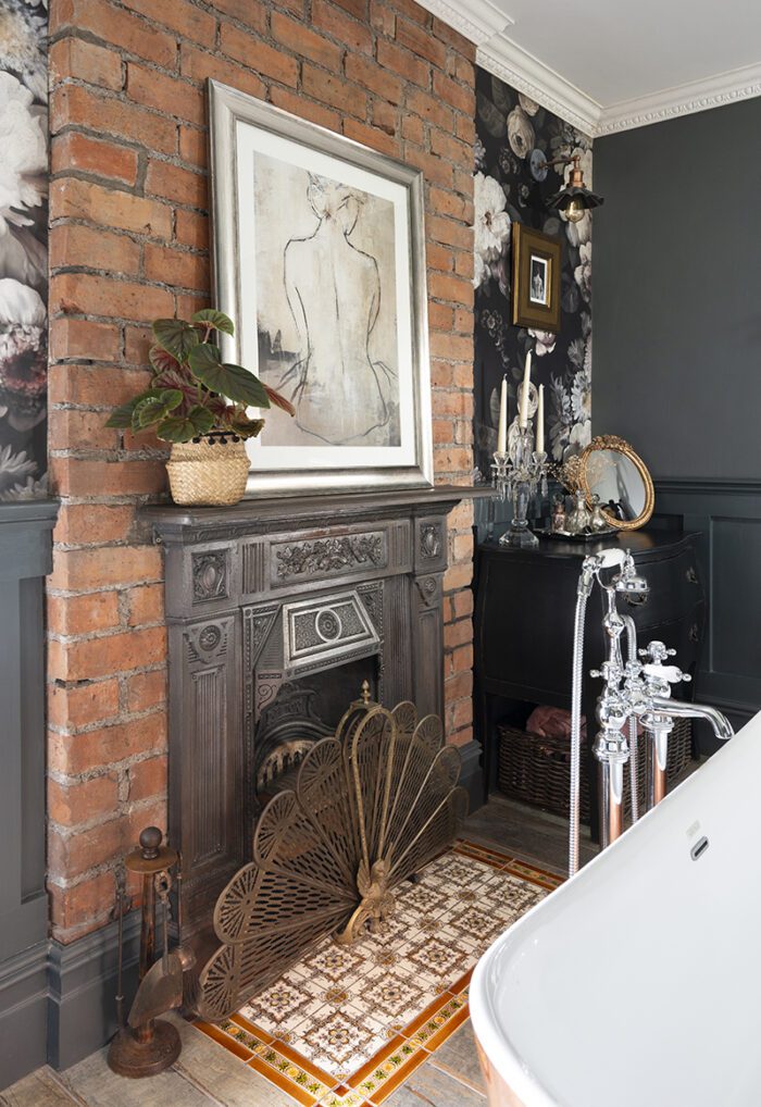 RESTORE AND REFRESH 
Layers of paint have been stripped from the fireplace to return it to metal and original tiles from another bedroom have been cleaned and relaid in the hearth to give a splash of colour, while the surface has been knocked off the chimney breast and the whole lot cleaned and sealed for an attractive exposed brickwork look. 
